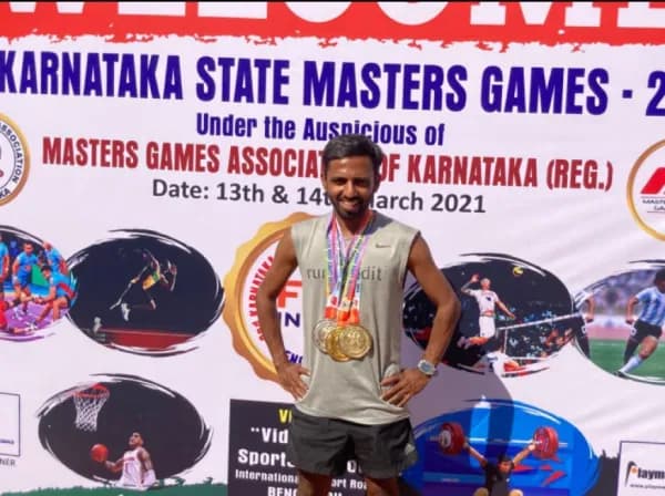 Coach Vikas with Gold and Silver medals